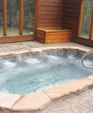 STAINLESS STEEL SPA WITH INTERIOR DESCENDING STAIRWAY AND EIGHT BUCKET SEATS